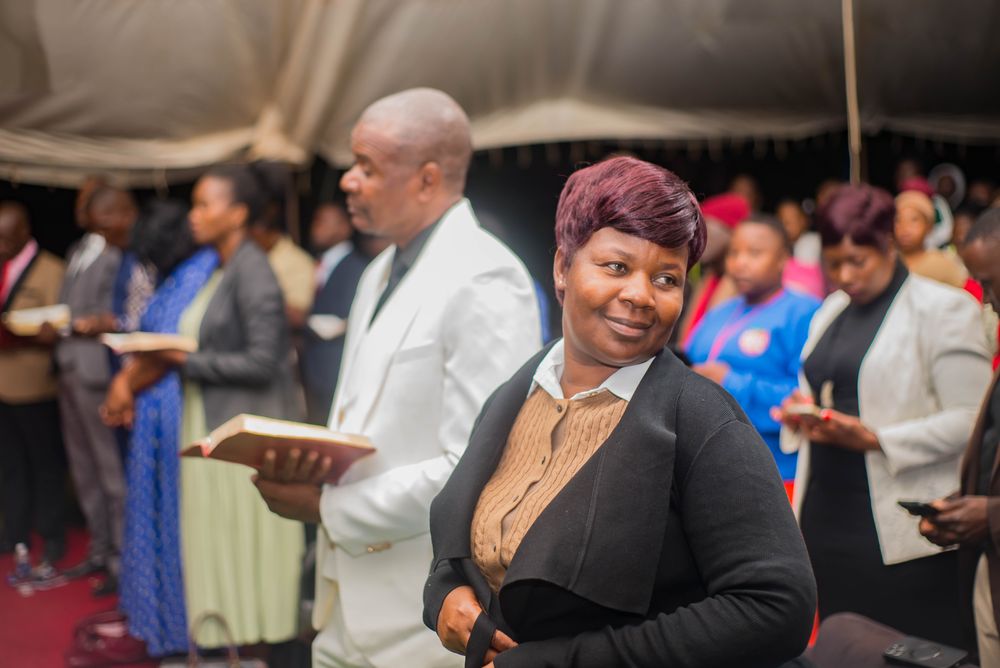 Minister preaching with open Bible