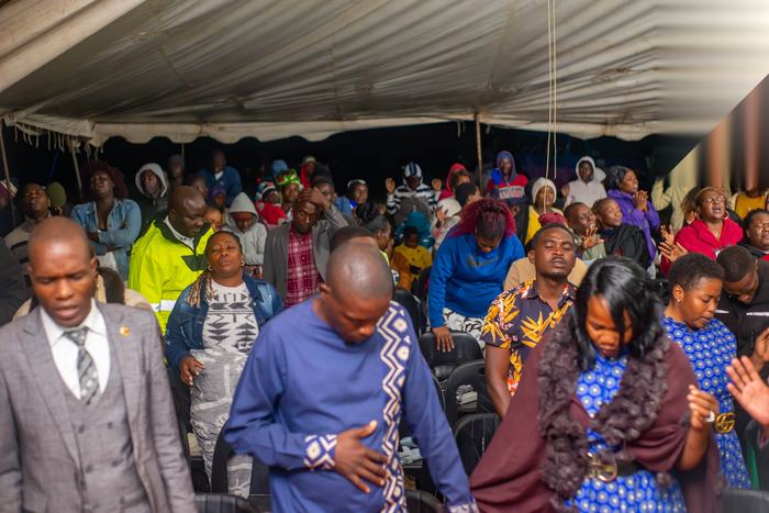 Crowd gathered under the tent