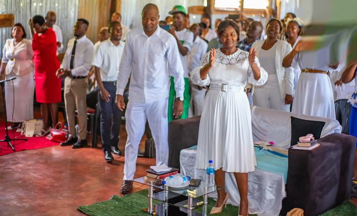 Hands raised during Sunday worship