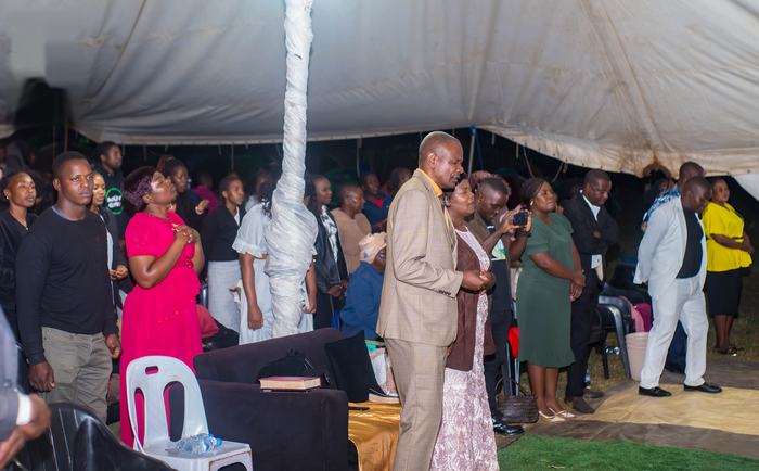 Members worshipping with joy